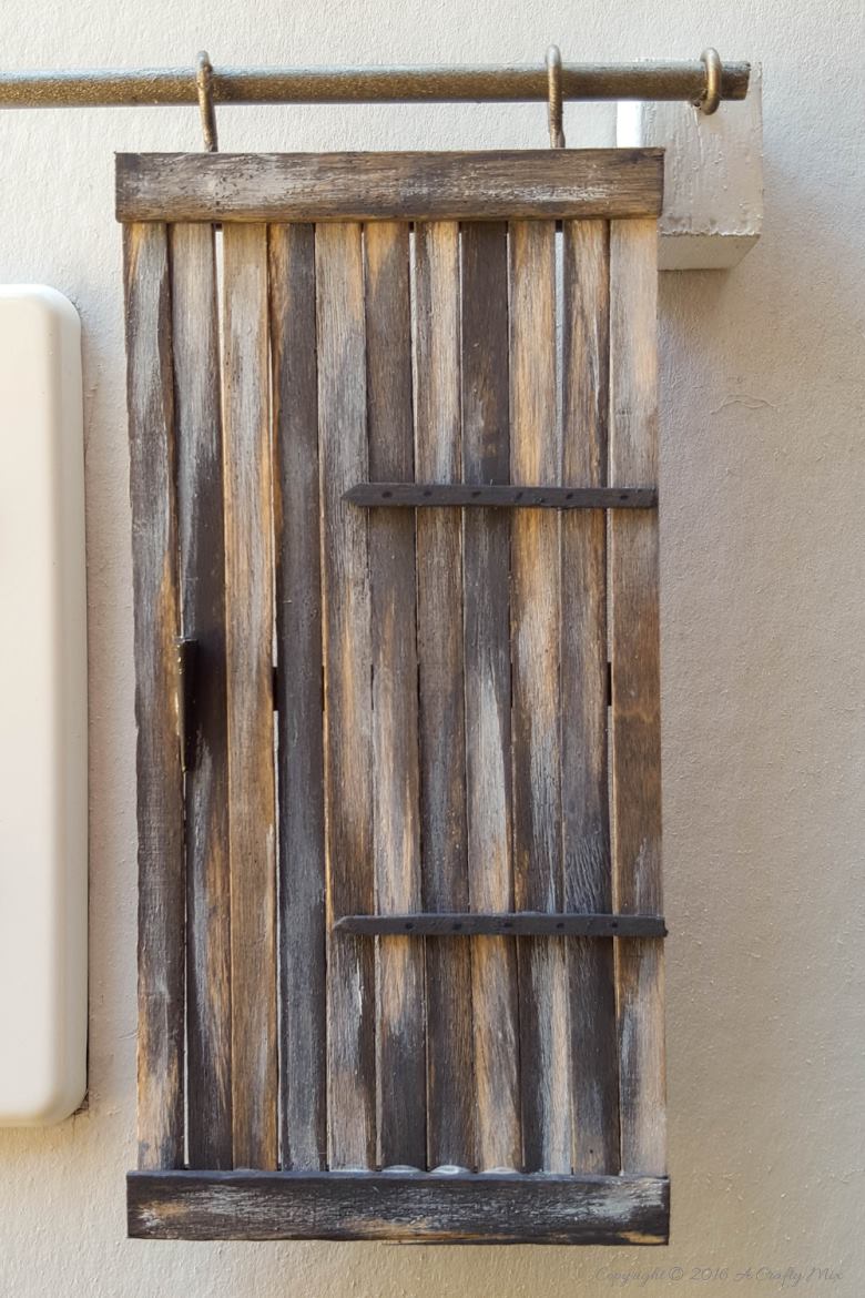 Make these adorable miniature barn doors to cover plugs. Or just hang them on the wall for a fun decor item. Quick and easy to make you can get the fill tutorial at acraftymix.com