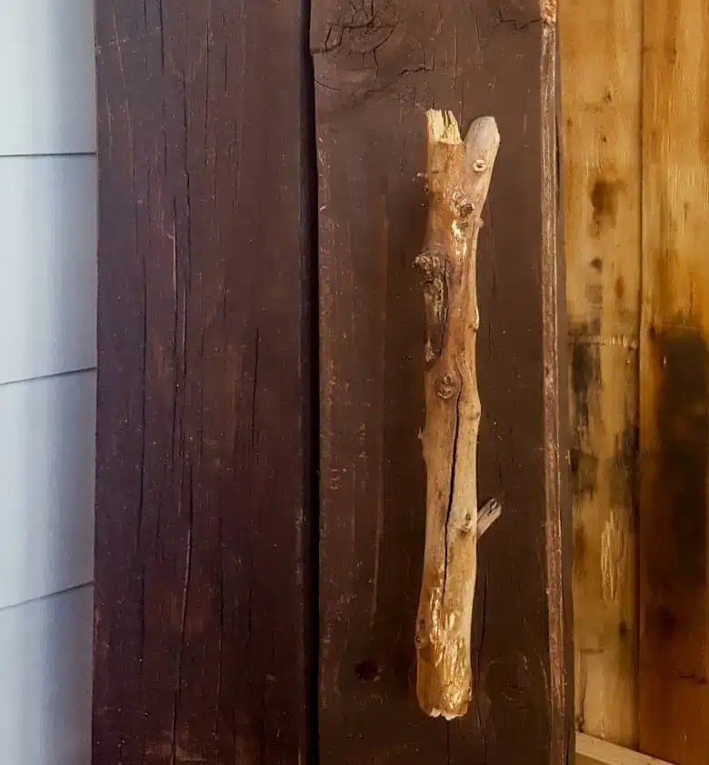 Turn a broken old ammo box into a small, sturdy kitchen cupboard. Perfect rustic home decor. This tutorial will also show you how to make a branch door handle #Repurpose #AmmoBox #ACraftyMix #RusticDecor #BranchUpcycle