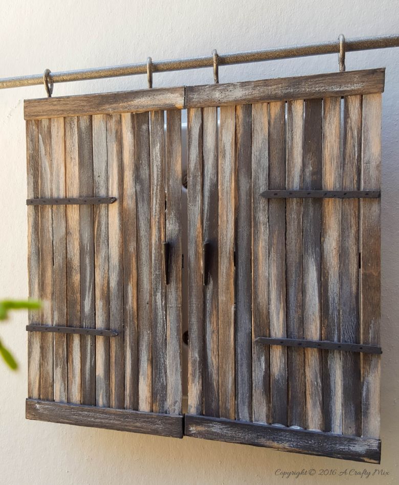 Make these adorable miniature barn doors to cover plugs. Or just hang them on the wall for a fun decor item. Quick and easy to make you can get the fill tutorial at acraftymix.com