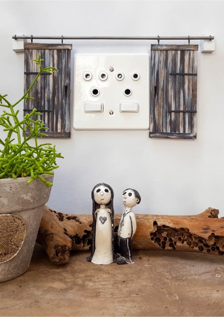 Make these adorable miniature barn doors to cover plugs. Or just hang them on the wall for a fun decor item. Quick and easy to make you can get the fill tutorial at acraftymix.com