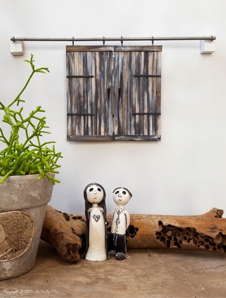 Make these adorable miniature barn doors to cover plugs. Or just hang them on the wall for a fun decor item. Quick and easy to make you can get the fill tutorial at acraftymix.com