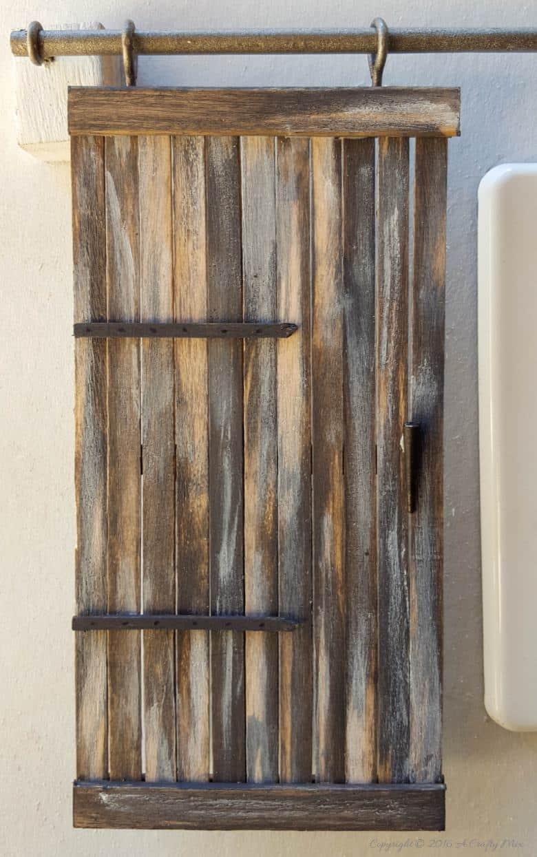 Make these adorable miniature barn doors to cover plugs. Or just hang them on the wall for a fun decor item. Quick and easy to make you can get the fill tutorial at acraftymix.com