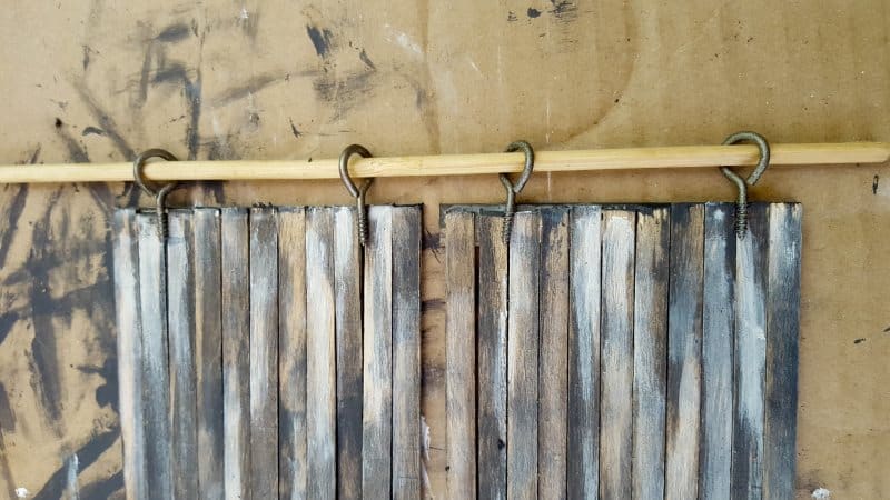 Line the hooks up with the top of the door
