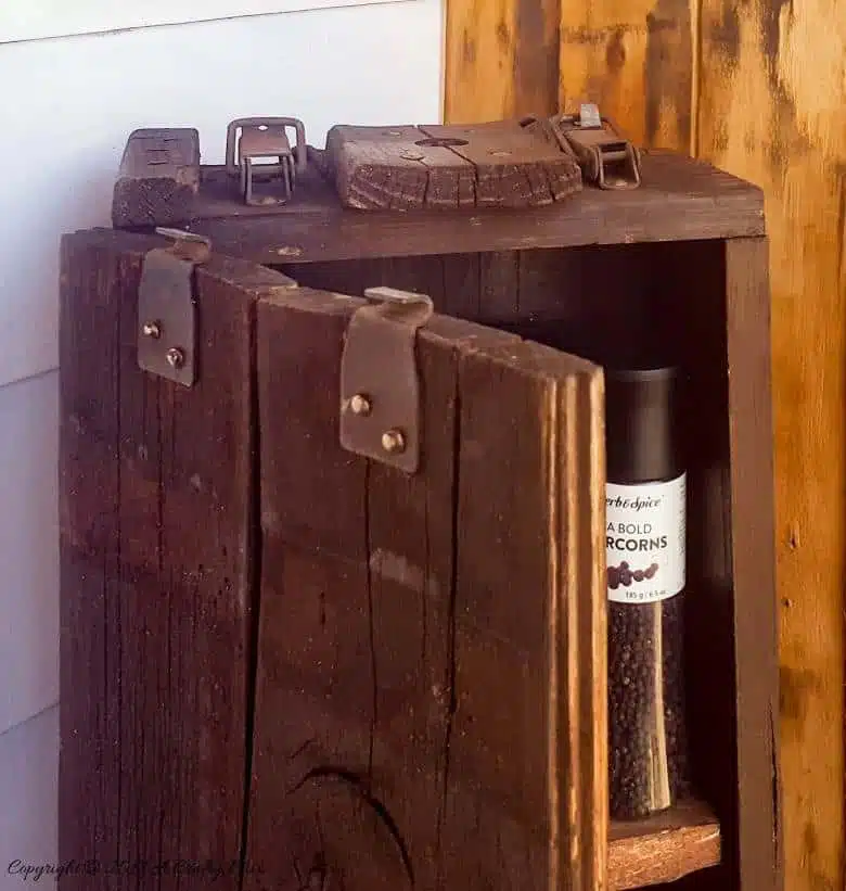 Turn a broken old ammo box into a small, sturdy kitchen cupboard. Perfect rustic home decor. This tutorial will also show you how to make a branch door handle #Repurpose #AmmoBox #ACraftyMix #RusticDecor #BranchUpcycle