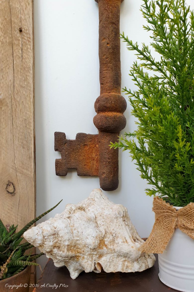 How to make a giant faux metal key. An experiment using expanding foam. Full tutorial on A Crafty Mix blog