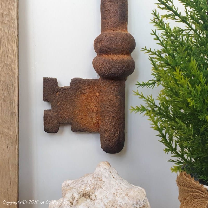 How to make a giant faux metal key. An experiment using expanding foam. Full tutorial on A Crafty Mix blog