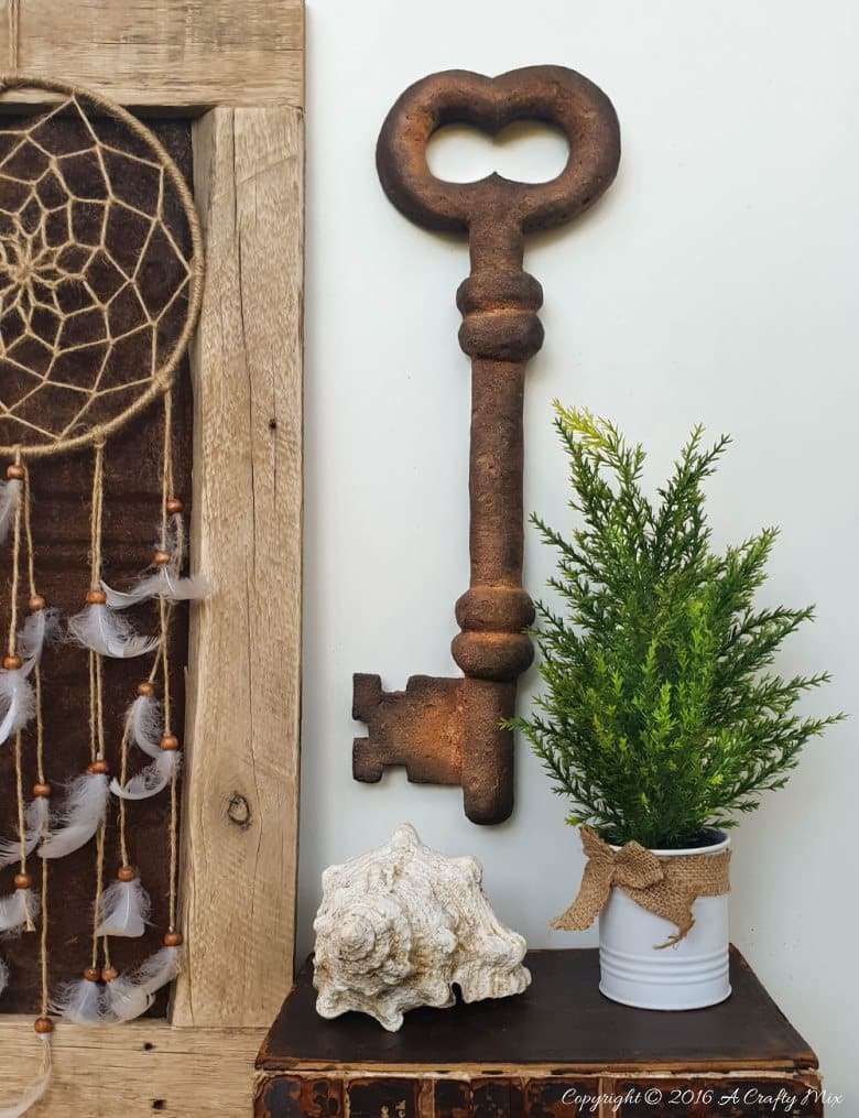 How to make a giant faux metal key. An experiment using expanding foam. Full tutorial on A Crafty Mix blog