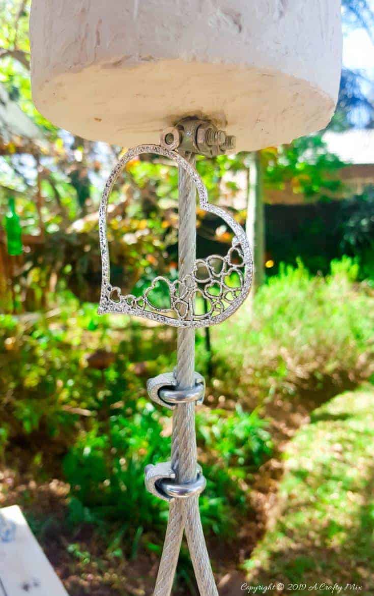Clamping the wire to finish off the swing #gardenswingDIY #Palletswing #romanticswing #acraftymix #fairytaleswing #gardenswingbuild