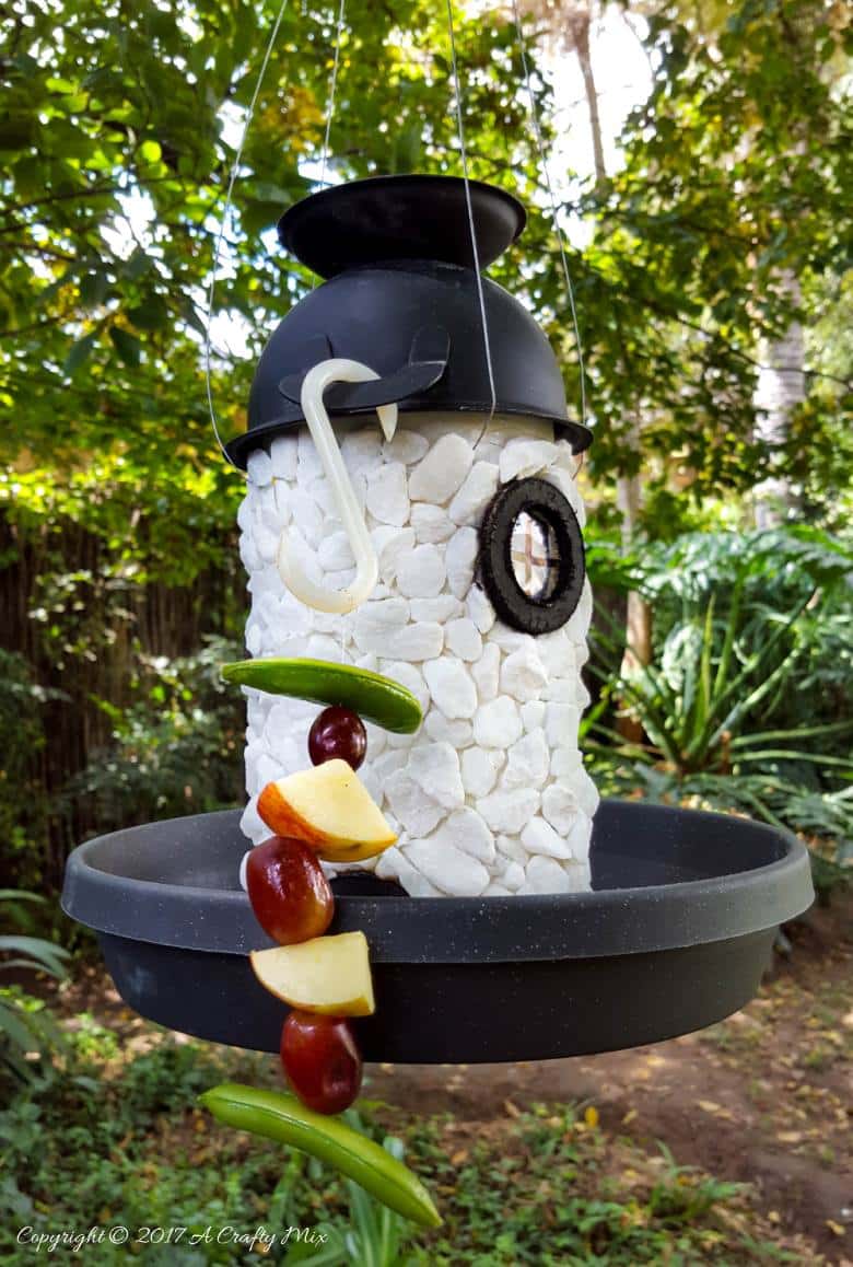 See how easy it is to turn a tin can into a fairy lighthouse bird feeder. #Birdfeeder #ACraftyMix