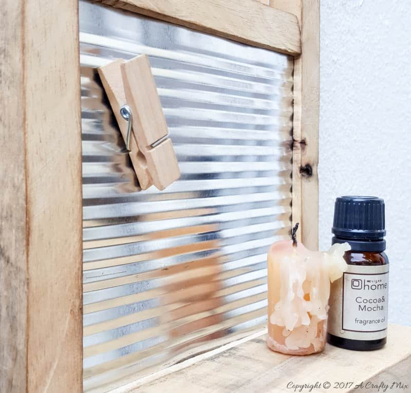 Isn't this antique washboard just too adorable. It's a great way to upcycle a tin can and add something special to your laundry room. #tincanupcycle #laundryroomdecor #acraftymix #DIYDecor #laundrystorage #tincanrepurpose #DIYWashboard