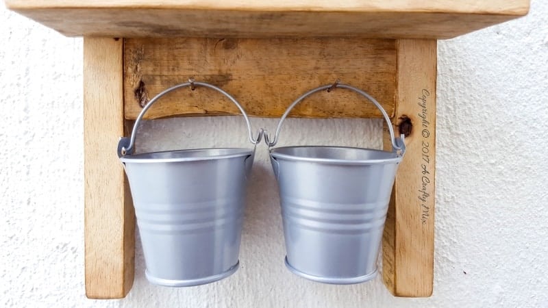 Isn't this antique washboard just too adorable. It's a great way to upcycle a tin can and add something special to your laundry room. #tincanupcycle #laundryroomdecor #acraftymix #DIYDecor #laundrystorage #tincanrepurpose #DIYWashboard