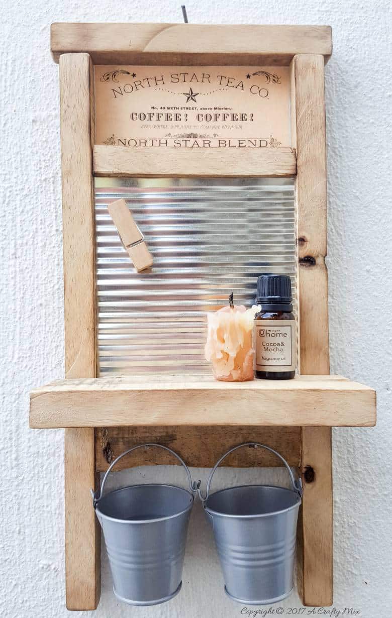 Isn't this antique washboard just too adorable. It's a great way to upcycle a tin can and add something special to your laundry room. #tincanupcycle #laundryroomdecor #acraftymix #DIYDecor #laundrystorage #tincanrepurpose #DIYWashboard