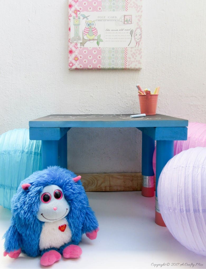 Turn any ordinary blackboard craft table into something different with these giant pencil legs. A quick and easy DIY upcycle tutorial that kids will love. #HomeDecor #ACraftyMix #PVC