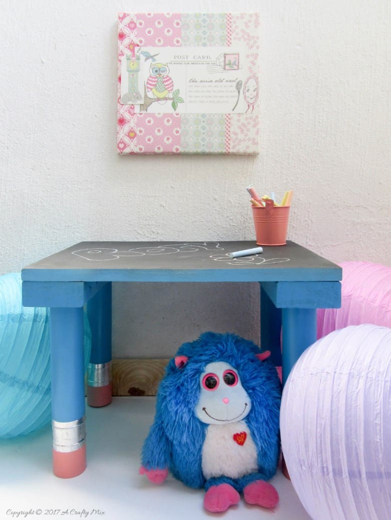 Turn any ordinary blackboard craft table into something different with these giant pencil legs. A quick and easy DIY upcycle tutorial that kids will love. #HomeDecor #ACraftyMix #PVC