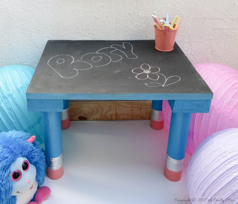 Turn any ordinary blackboard craft table into something different with these giant pencil legs. A quick and easy DIY upcycle tutorial that kids will love. #HomeDecor #ACraftyMix #PVC