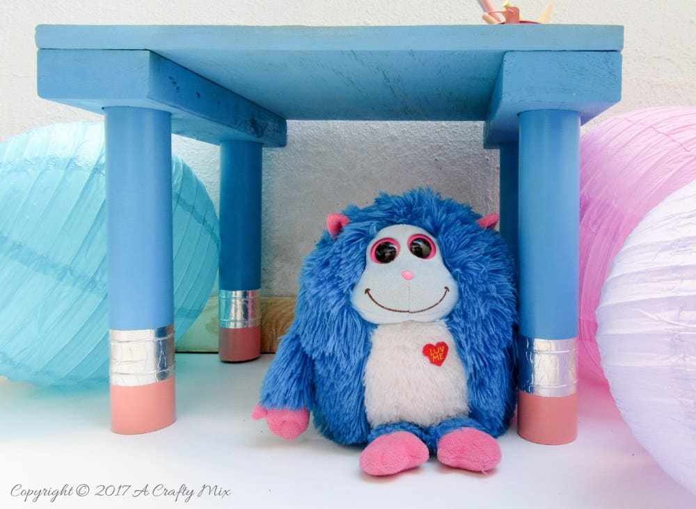 Turn any ordinary blackboard craft table into something different with these giant pencil legs. A quick and easy DIY upcycle tutorial that kids will love. #HomeDecor #ACraftyMix #PVC