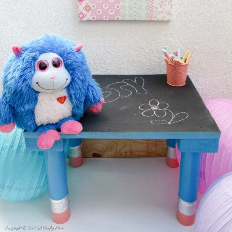 Turn any ordinary blackboard craft table into something different with these giant pencil legs. A quick and easy DIY upcycle tutorial that kids will love. #HomeDecor #ACraftyMix #PVC
