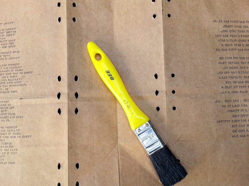 Printed script on brown paper with holes