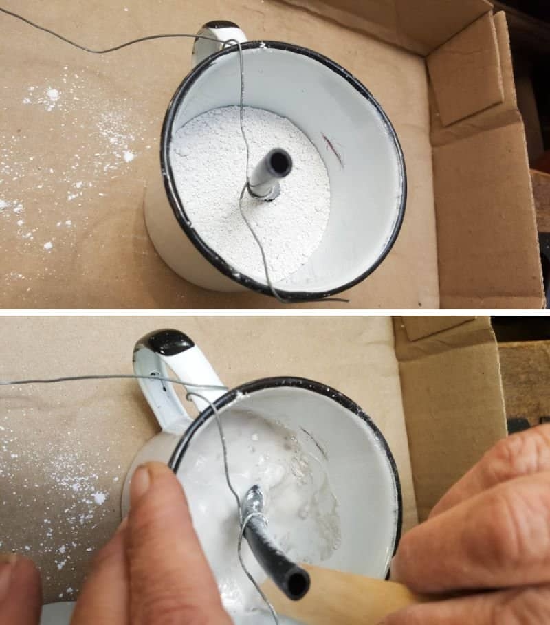 Mix up a small batch of plaster of paris inside the enamel cup to give it some weight