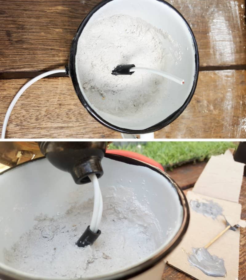 Thread the wire up through the plastic pipe or tube and then into the light fitting. The light switch goes on the outside of the enamel cup.