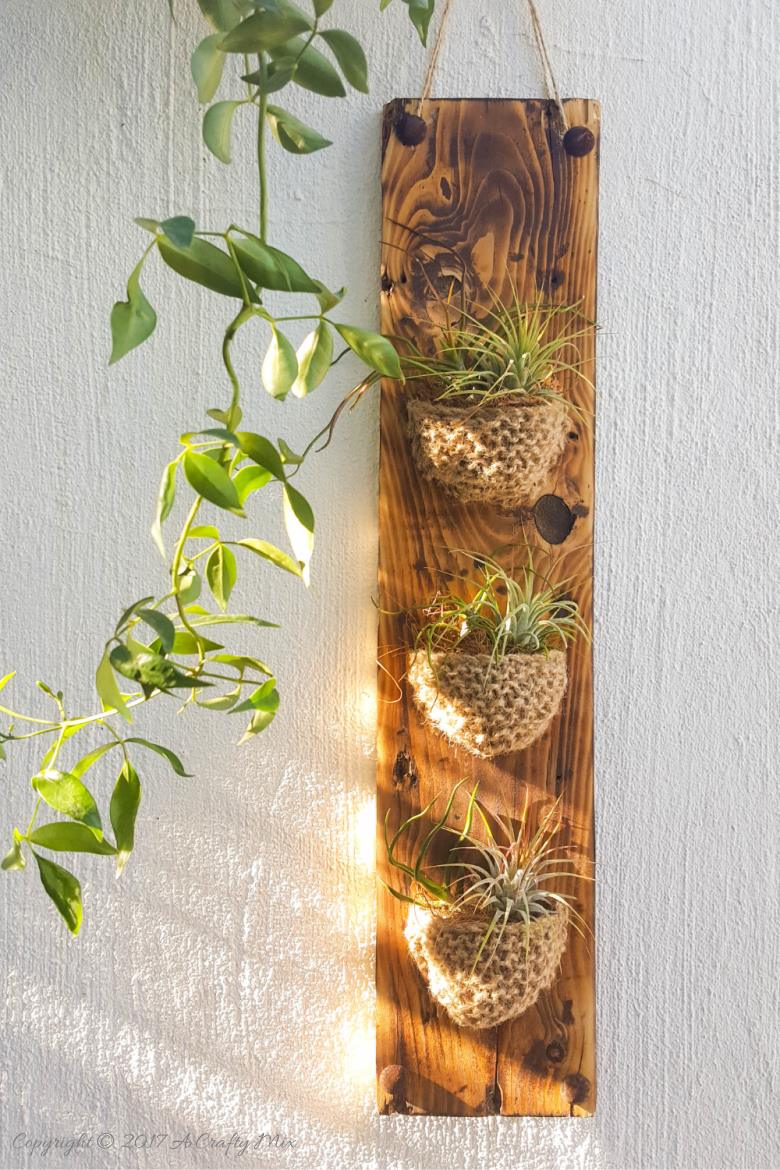 Add something special to your garden with this easy to make knitted planter. Perfect for air plants or succulents #Planter #ACraftyMix #GardenDecor