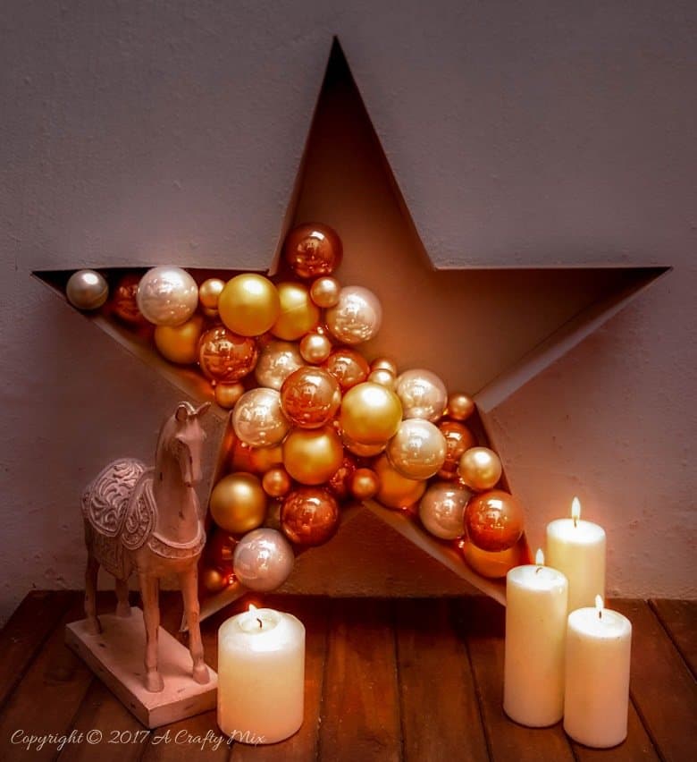 Add a touch of magic to your Christmas decor and make this stunning and simple bauble and light filled star