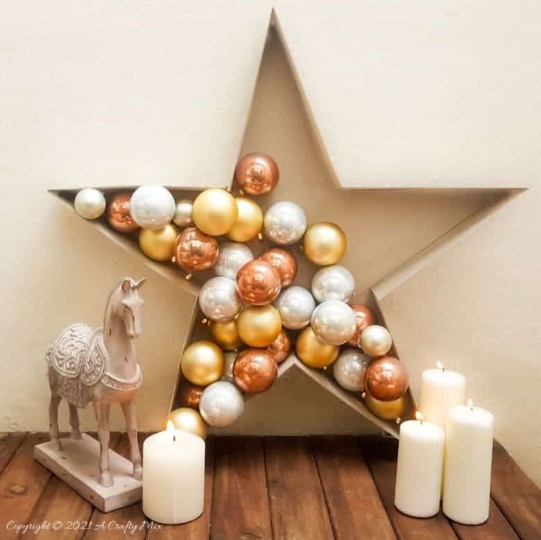 Add a touch of magic to your Christmas decor and make this stunning and simple bauble and light filled star