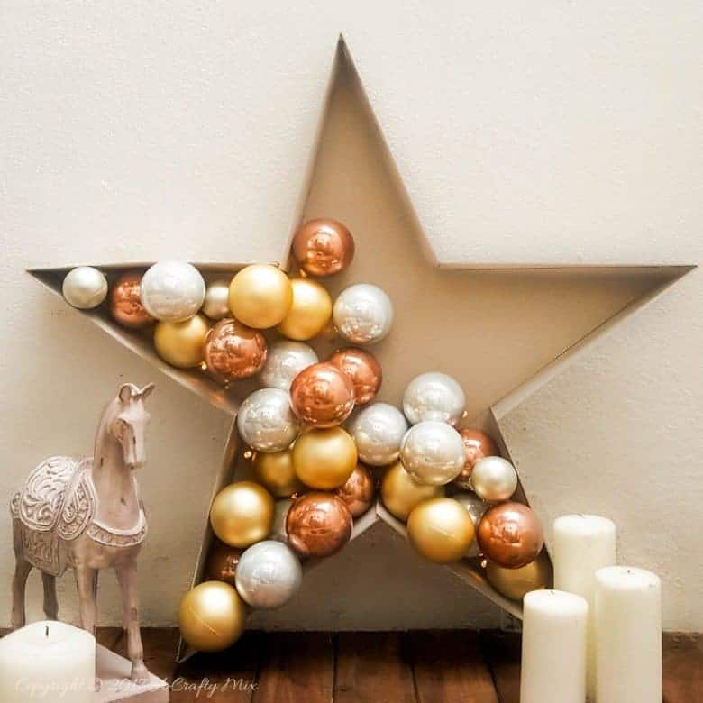 Add a touch of magic to your Christmas decor and make this stunning and simple bauble and light filled star