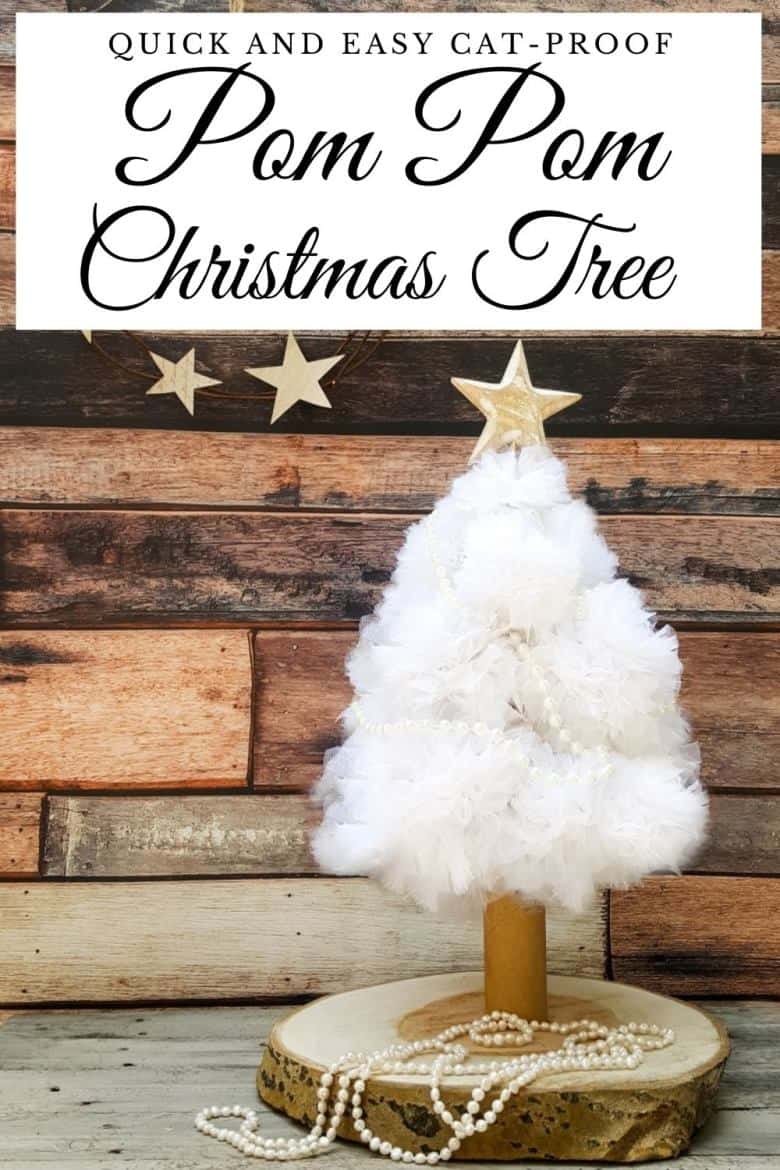 A quick and easy cat proof pom pom Christmas tree. I love how pretty it looks when it lights up at night. Christmas tree alternative ideas to make yourself #DIYChristmasTree #AlternativeChristmasTree #AcraftyMix #EasyCraftIdea #ChristmasDecor