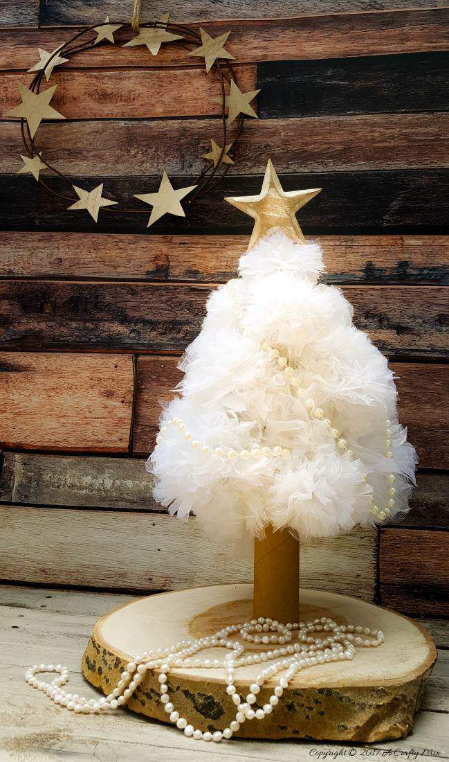 A quick and easy cat proof pom pom Christmas tree. I love how pretty it looks when it lights up at night. Christmas tree alternative ideas to make yourself #DIYChristmasTree #AlternativeChristmasTree