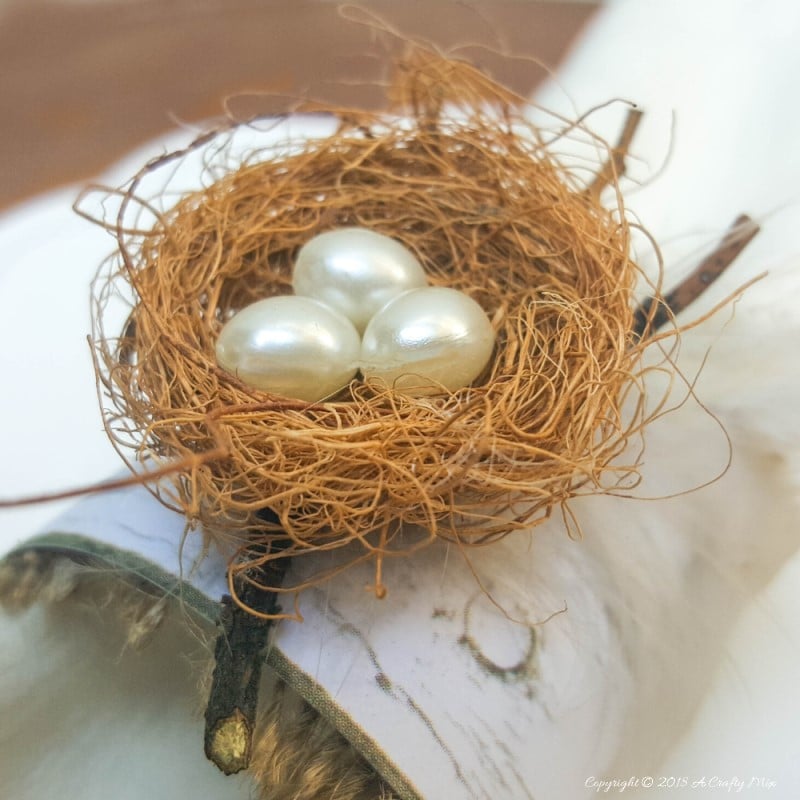 An easy and budget friendly craft tutorial for DIY bird&rsquo;s nest napkin rings using recycled materials is an inexpensive and beautiful way to make your own napkin ring holders! #craftsforkids #tabledecor #makeyourown