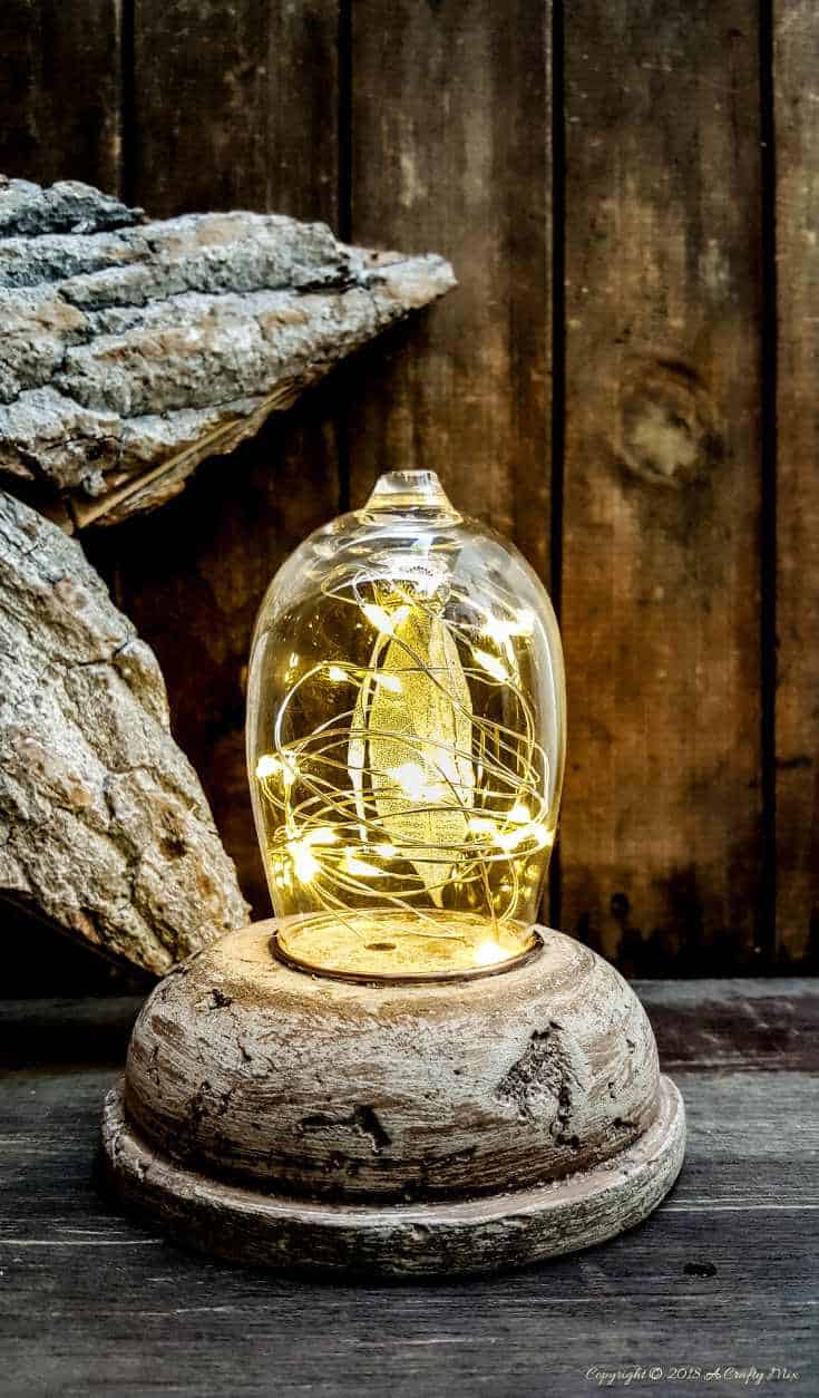 A dreamy repurposed wine goblet filled with fairy lights and tips on how to work with concrete #repurposed #concrete #tips