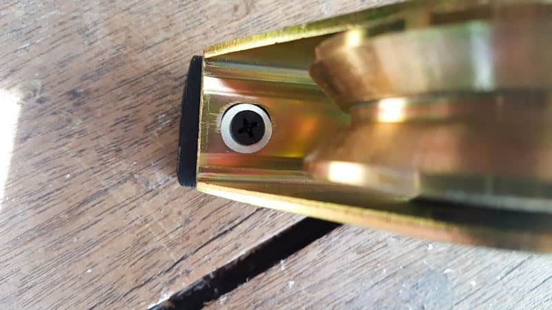 Screw the wheel metal casing onto the cut piece of wood