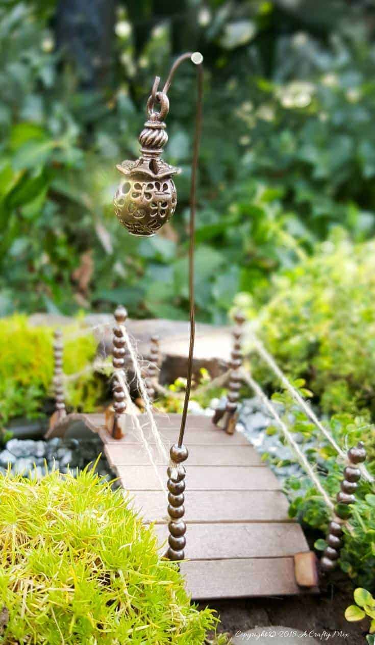 Recycle an empty plastic container and make and this adorable fairy bridge for your fairy garden. Easy to make