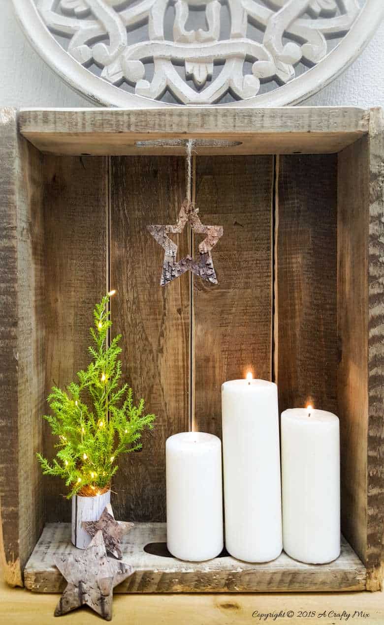 These 5 minute DIY Miniature Christmas Trees with lights are easy, inexpensive and soooo much fun to make. Add a little festive cheer to your home with these adorable table top Christmas tree decorations! #DIYChristmastree #DIYHolidaydecor #Christmascraftsforkids #Christmastabledecor #Festivetabledecor