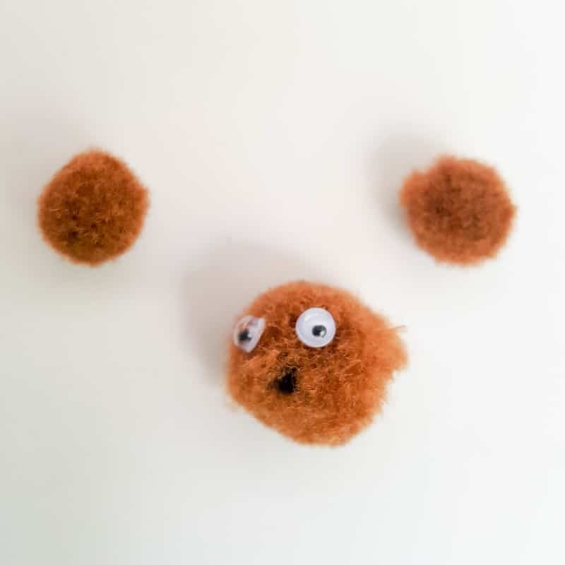 Glue the small eyes on to the miniature teddy bear