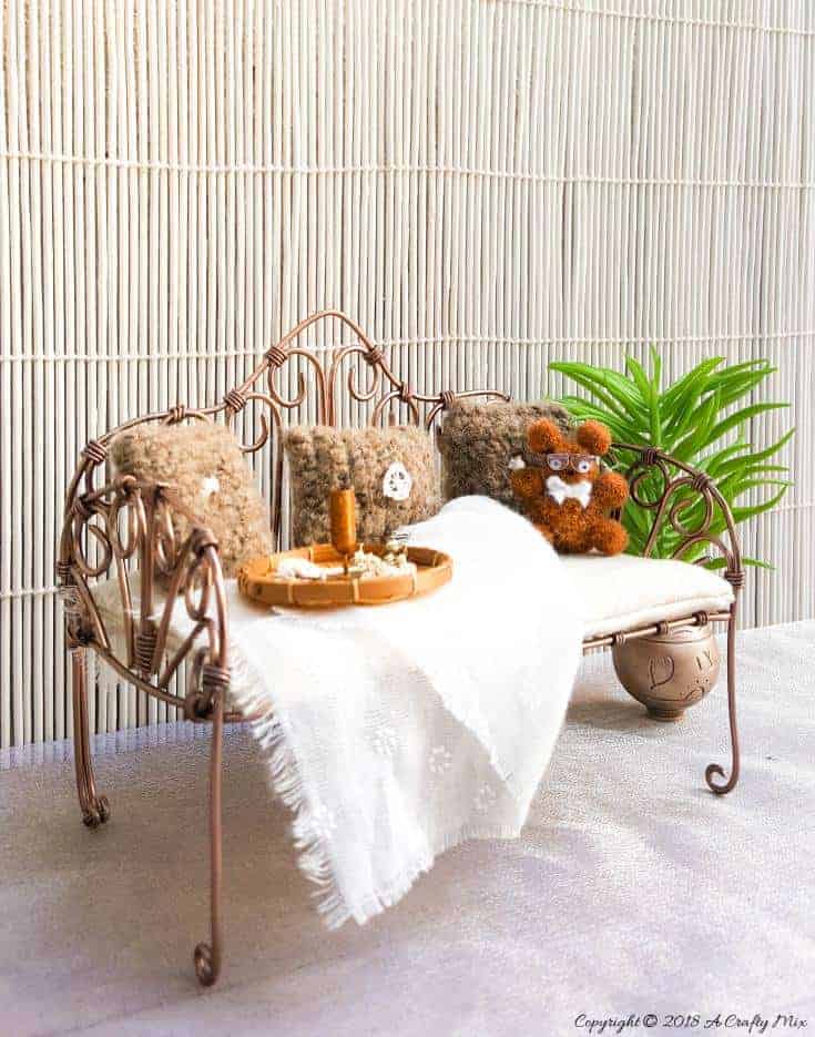 This DIY fantasy fairy Daybed is the perfect place for the garden fairies to relax and unwind after a long day of playing and it works well for many parts of the fairy garden #Fairygarden #wiredaybed #fairydaybed #fairyfurniture