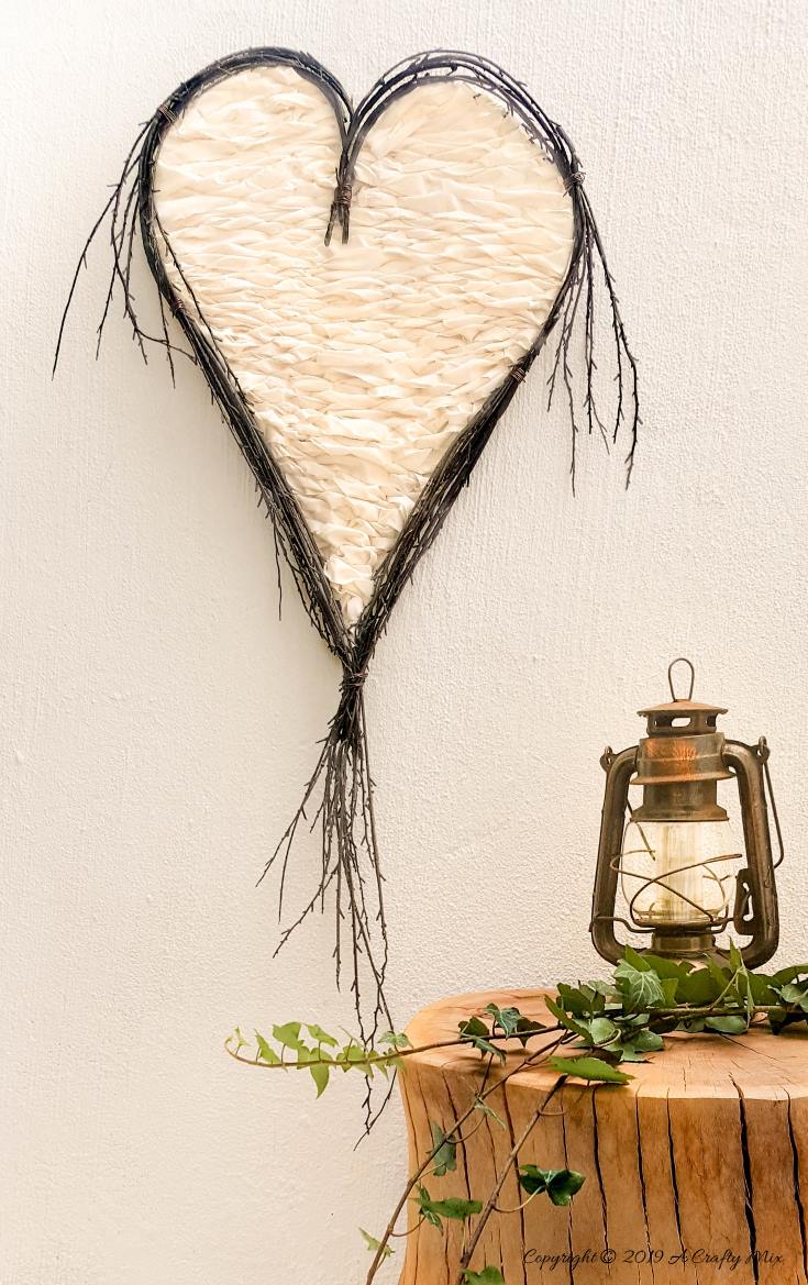 How to make a heart twig loom. Beautiful boho decor inspired by nature and love #BohoDecor #Valentinesday #WallArt #WeavingTutorial