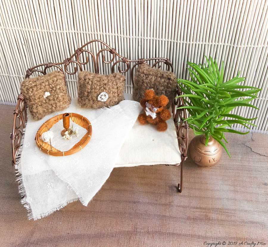 This DIY fantasy fairy Daybed is the perfect place for the garden fairies to relax and unwind after a long day of playing and it works well for many parts of the fairy garden #Fairygarden #wiredaybed #fairydaybed #fairyfurniture