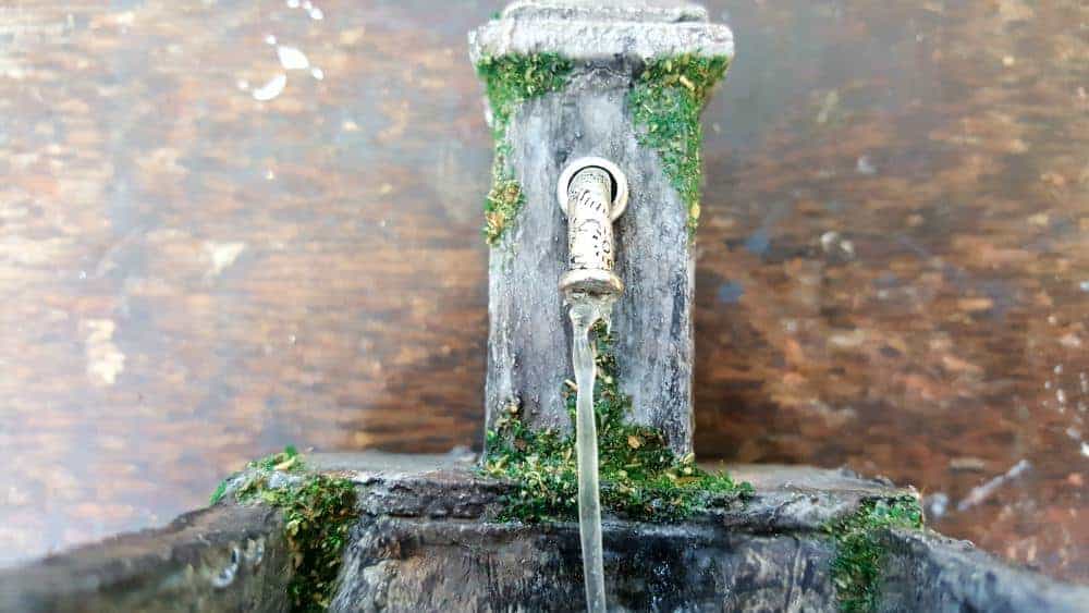Close up of the running water. How to make a beautiful fairy water feature with "running" water #Miniaturewaterfeature #DIYFairyWaterFeature #WaterFeature #FairyGardens #ACraftyMix
