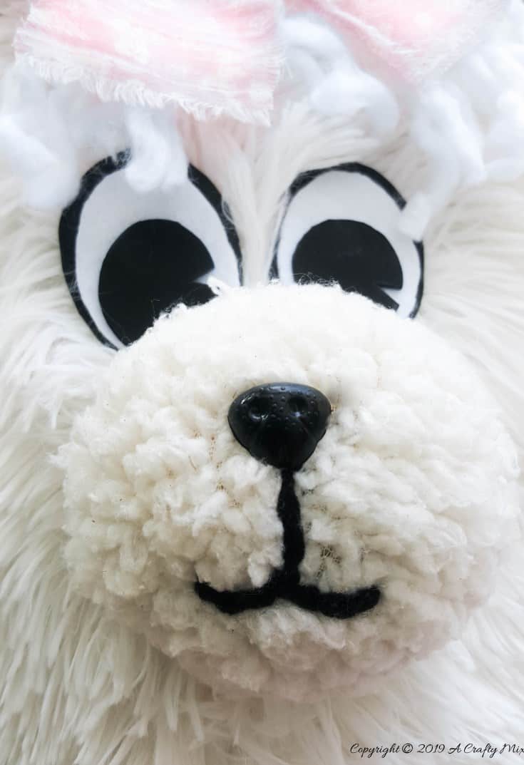 Close up view of the llama's face with pink bow and curly hair. DIY Tutorial from A Crafty Mix #llamaDIY #DIYTutorial #LlamaChair