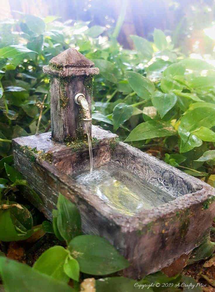 How to make a beautiful fairy water feature with "running" water #Miniaturewaterfeature #DIYFairyWaterFeature #WaterFeature #FairyGardens #ACraftyMix