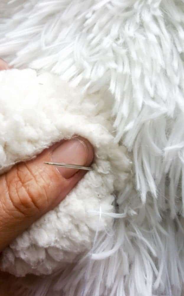 Hand sew the nose on. DIY Tutorial from A Crafty Mix #llamaDIY #DIYTutorial #LlamaChair