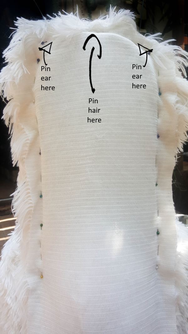 Using the patter pieces to cut the body and neck for the llama chair. DIY Tutorial from A Crafty Mix #llamaDIY #DIYTutorial #LlamaChair