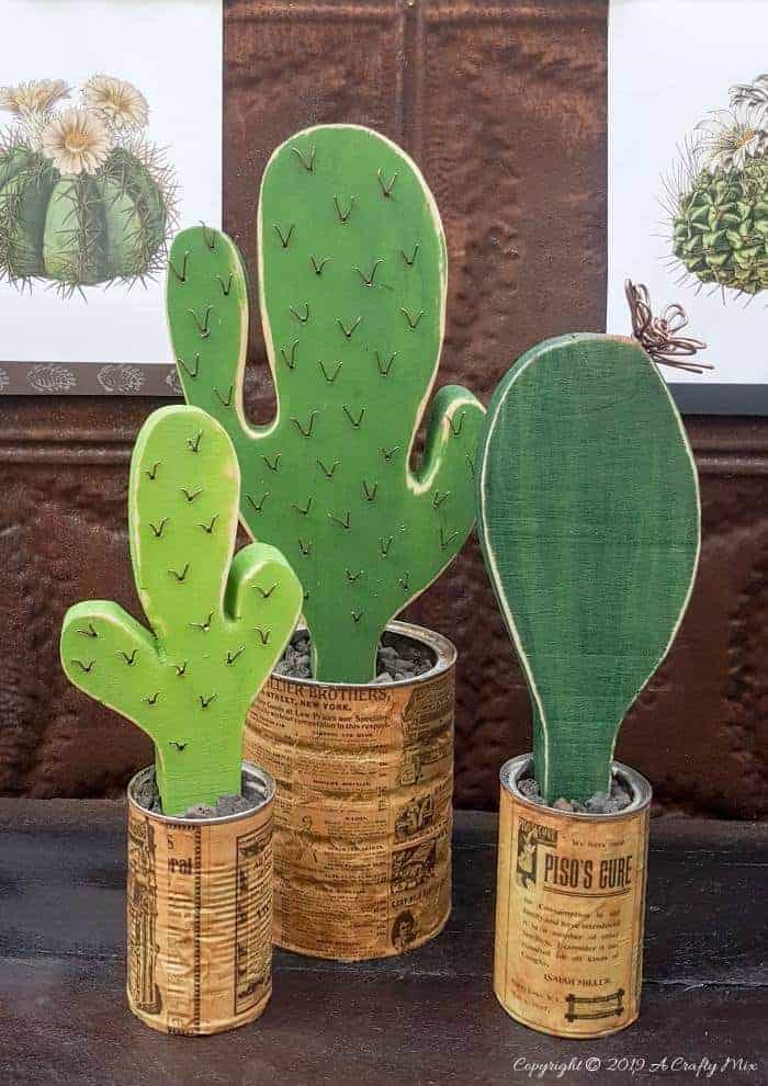 How to make your own wooden cacti. Perfect home decor for anyone who struggles to keep plants alive or if you want to add a little greenery to your space. #BrownThumb #WoodenCacti #tincanrepurpose #DIYTutorial #ACraftyMix