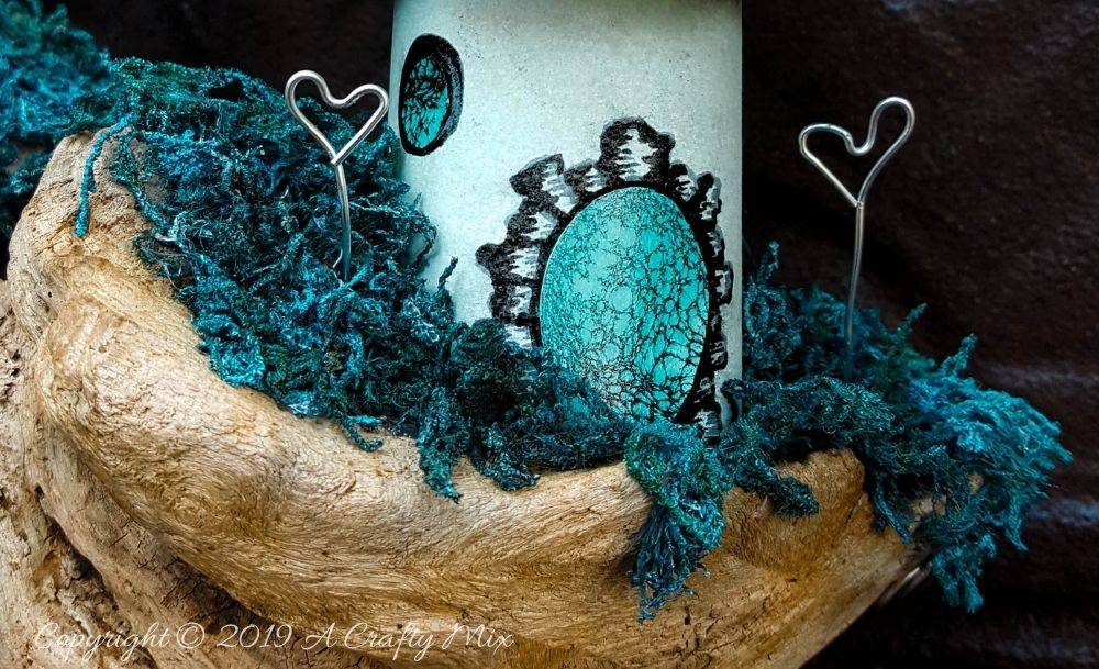 A close up view of the driftwood fairy scape and door