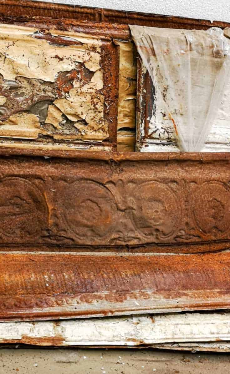 A whole bunch of rusty tin ceiling tiles (metal pressed) - #tinceilingideas #tinceilinghomedecor #tinceilingtilesrepurposed #plantstandideas #ACraftyMix