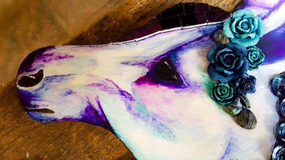 A close up of the unicorn's face after painting #mosaicprojects #tipsandtricks #howtomake #mixedmediamosaic #acraftymix #unicornspit #mosaicart #mosaicideas #unicornart