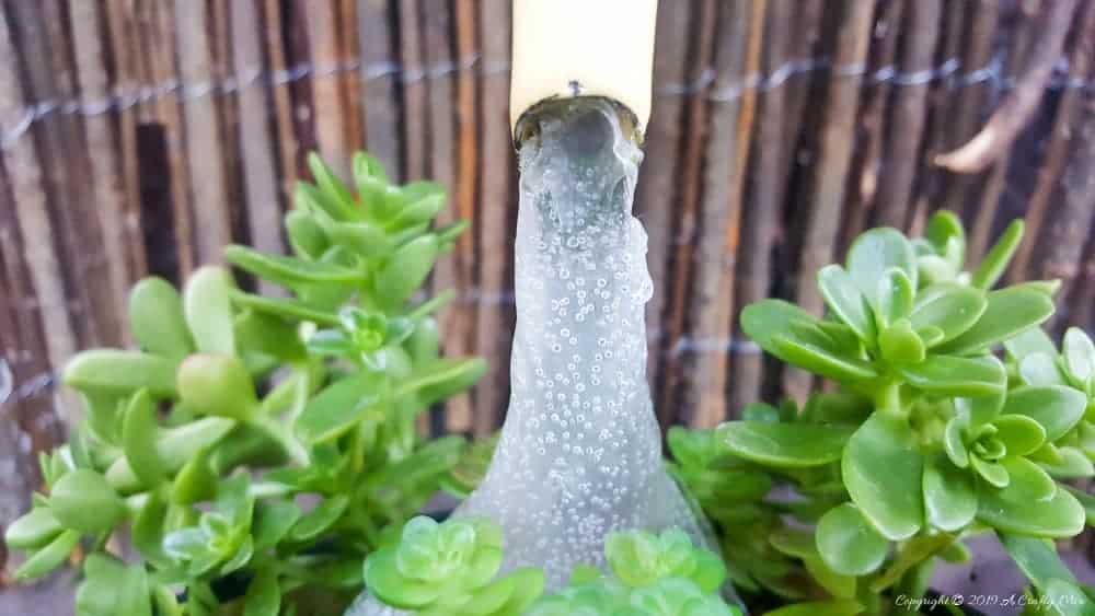 Making faux water for the floating teapot. Come see how to make your own #SucculentPlanter #FloatingTeapot #ACraftyMix #DIYTutorial #ForkRepurpose #CrazyCrafts