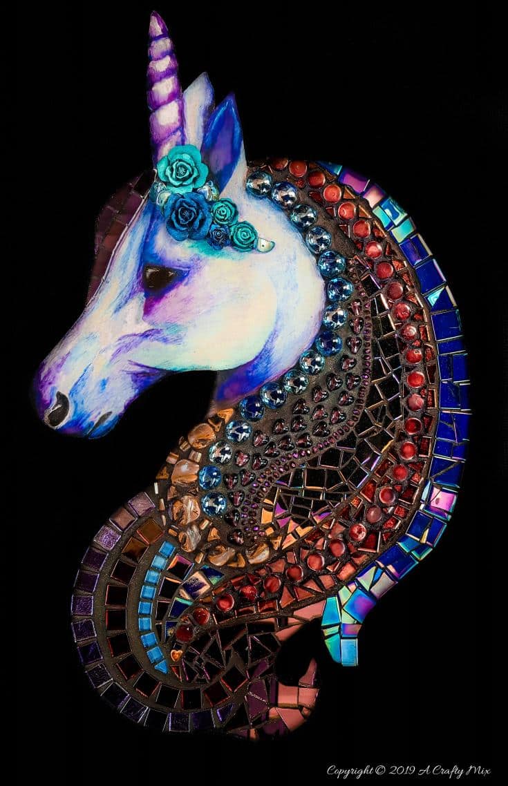 The colors in this mixed media mosaic unicorn are beautiful. Great tutorial that shows how to do something similar with lots of tips and tricks. #mosaicprojects #tipsandtricks #howtomake #mixedmediamosaic #acraftymix #unicornspit #mosaicart #mosaicideas #unicornart